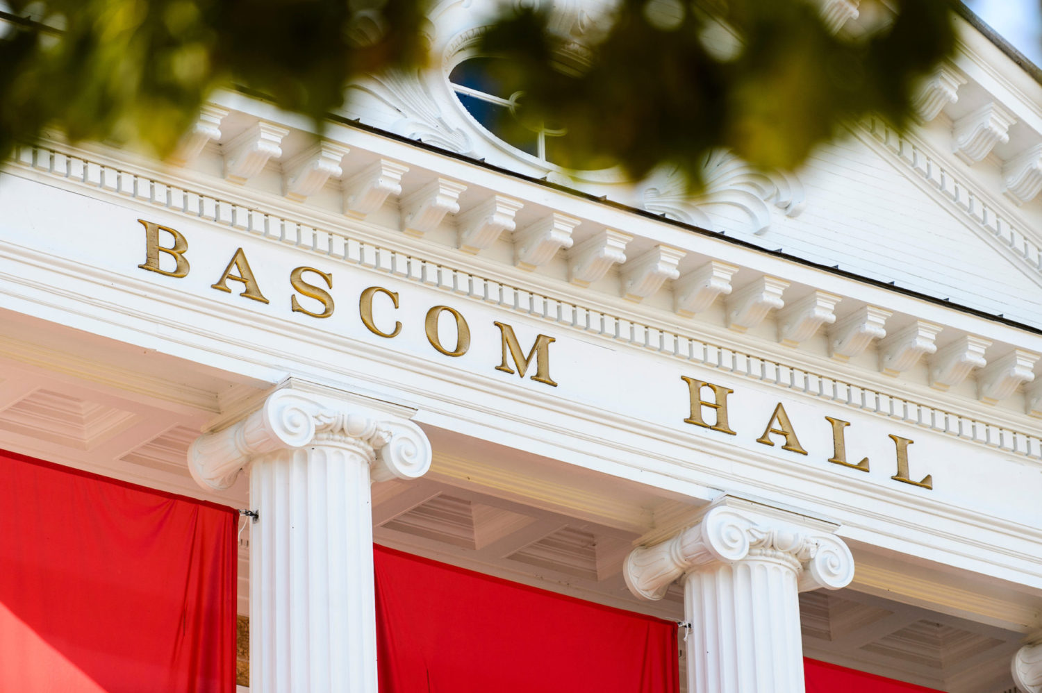 Bascom Hall sign displayed above columns on building.